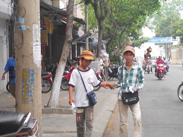 Children selling lottery tickets